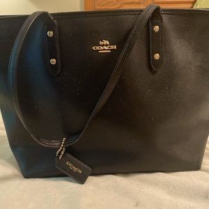 Coach tote bag. Black with tan interior. 16 x 6 x 11.